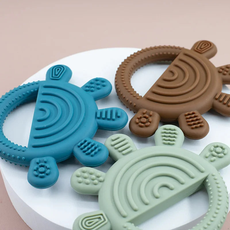 Close-up of textured rays on rainbow sun teethers
