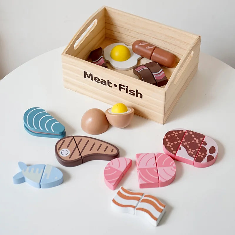 Wooden toy food set with a wooden box labeled 'Meat Fish' on a white surface.
