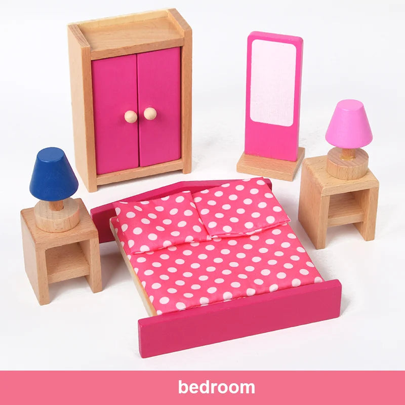 Wooden toy bedroom set with pink bed, wardrobe, and furniture on a white background.