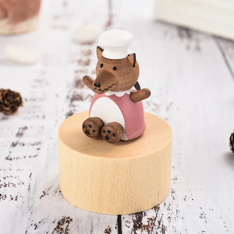Wooden figurine of a fox in a chef's outfit on a wooden base | Oliver & Company Montessori toys