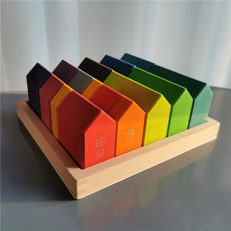 Colorful geometric blocks on a wooden base against a white background