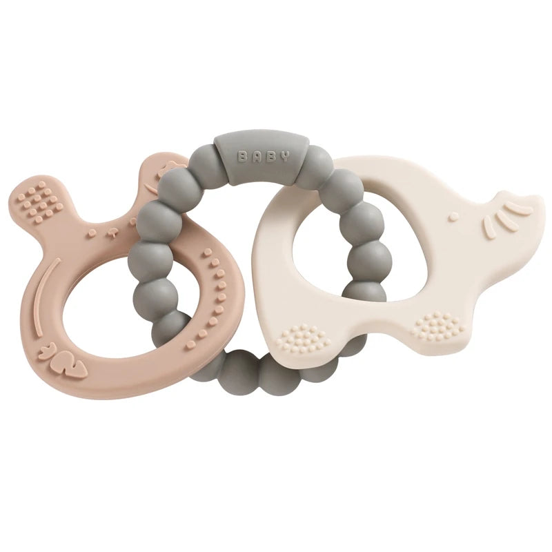 Two baby teething rings, one pink and one beige, with gray beads on a white background.