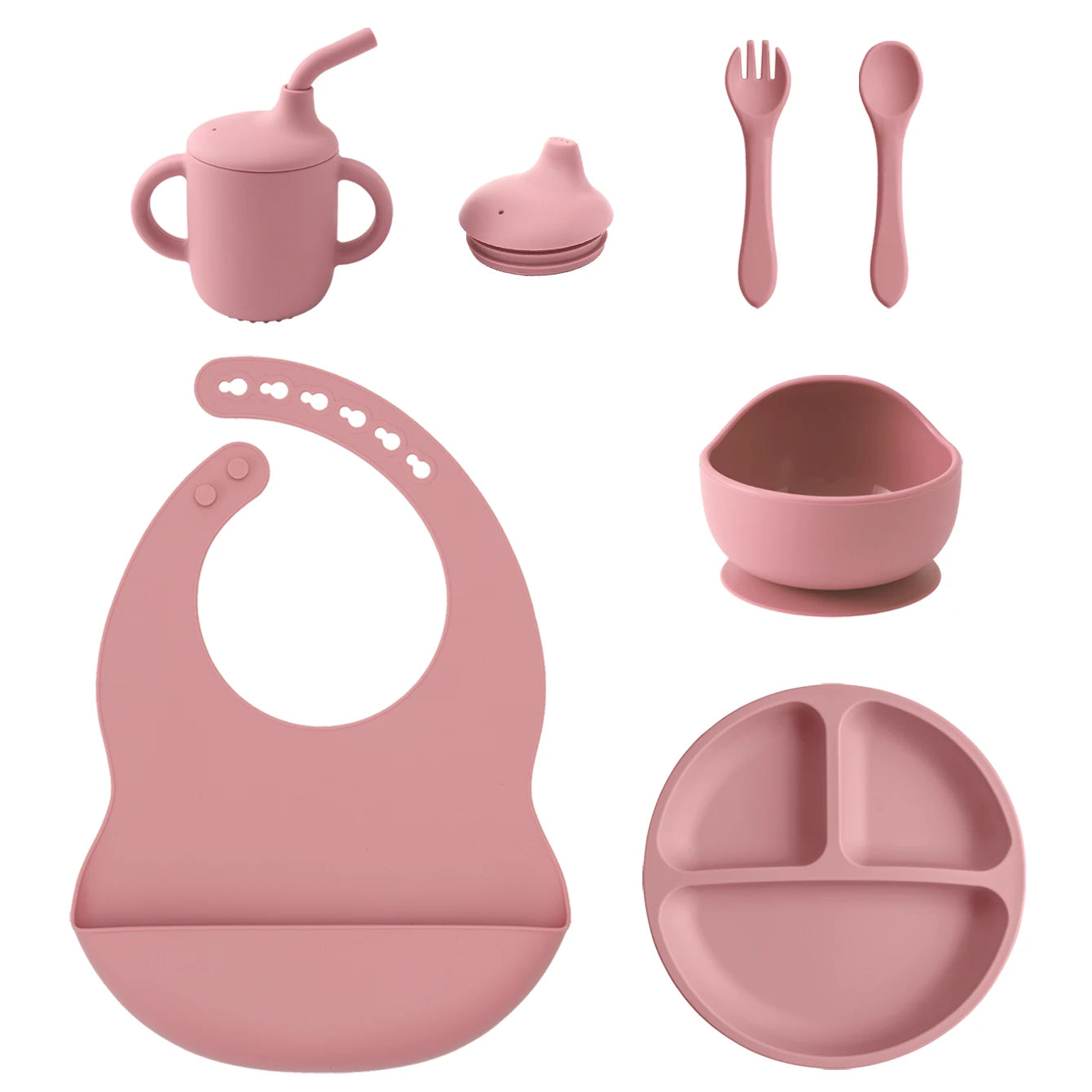 A coordinated baby feeding set in dusty pink silicone, including a handled sippy cup with straw, a small bottle, a fork, a spoon, a suction bowl, a bib, and a three-compartment divided plate on a white background.