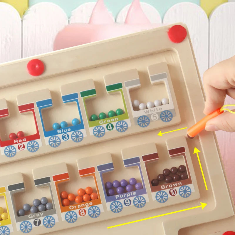 Color sorting toy with wooden frame and colorful beads, held by a hand.
