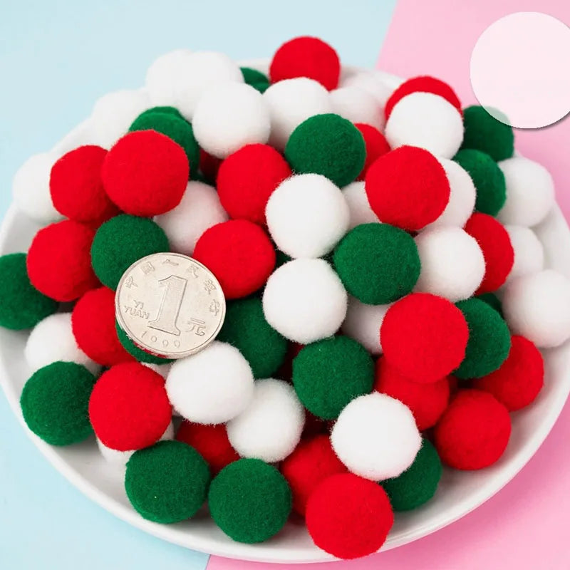 Colorful pom-poms on a plate with a coin for size reference