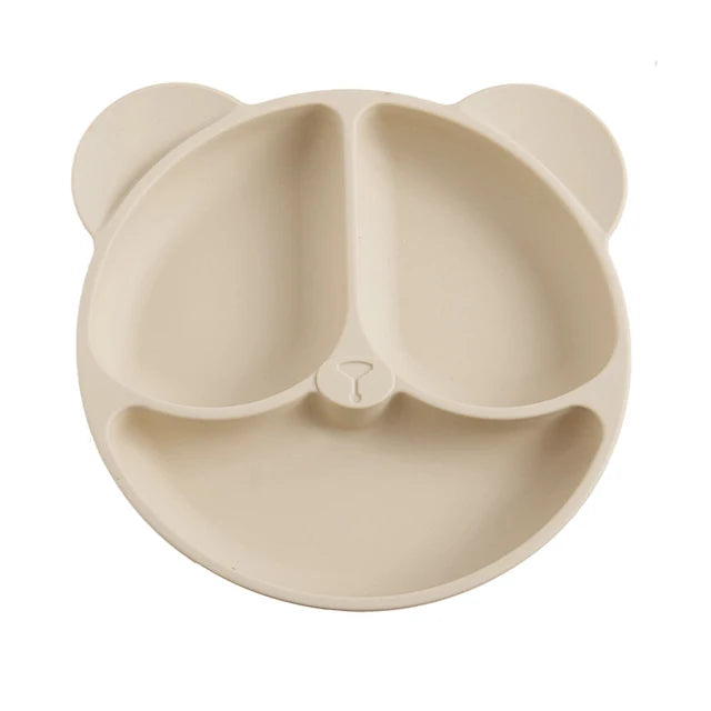 Beige bear-shaped plate on a white background