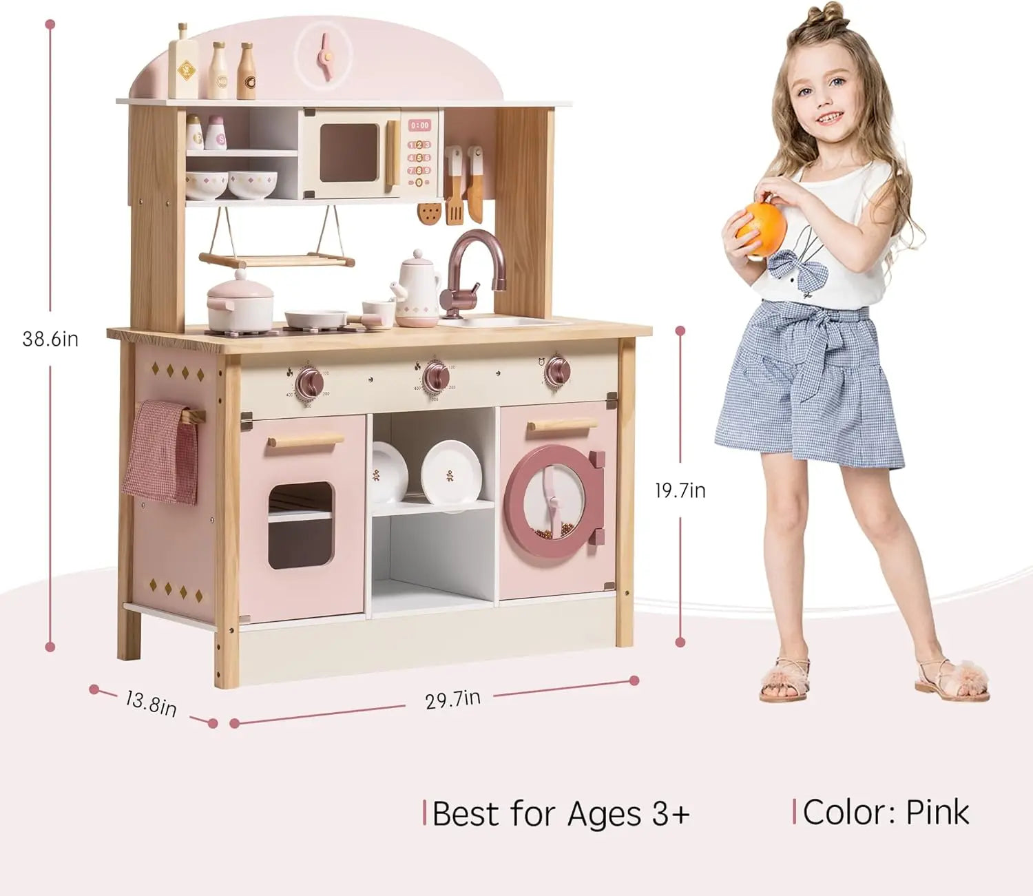 Children's pink play kitchen set with measurements and a child holding an orange.