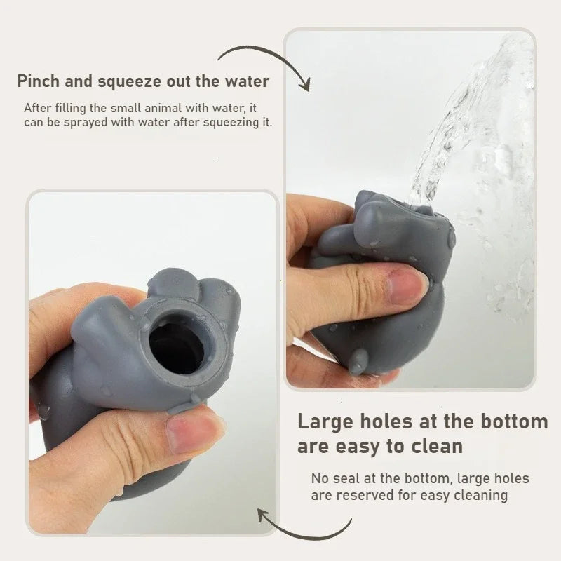 A gray animal-shaped water spray bottle shown in a two-panel demonstration on a light background. Text explains how to squeeze out water and notes the large bottom holes for easy cleaning.