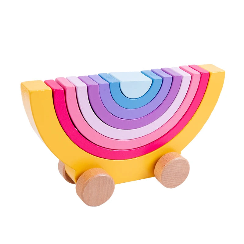 Colorful wooden rainbow toy with wheels on a white background