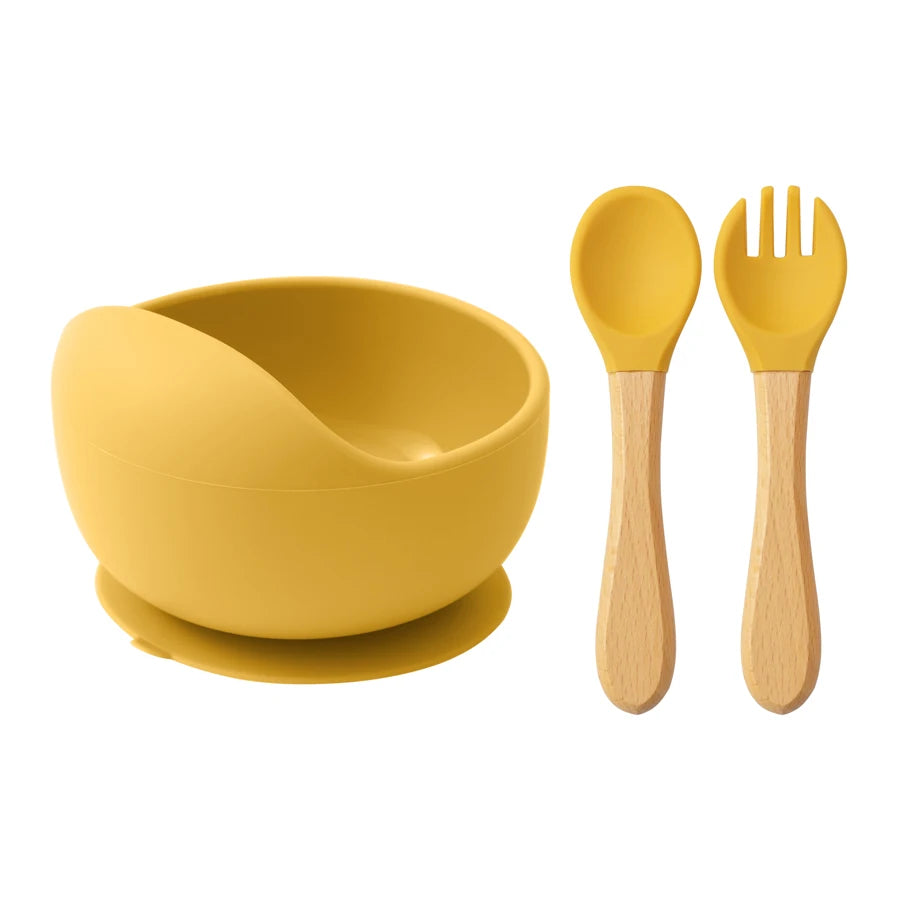 Mustard silicone suction bowl with wooden spoon and fork