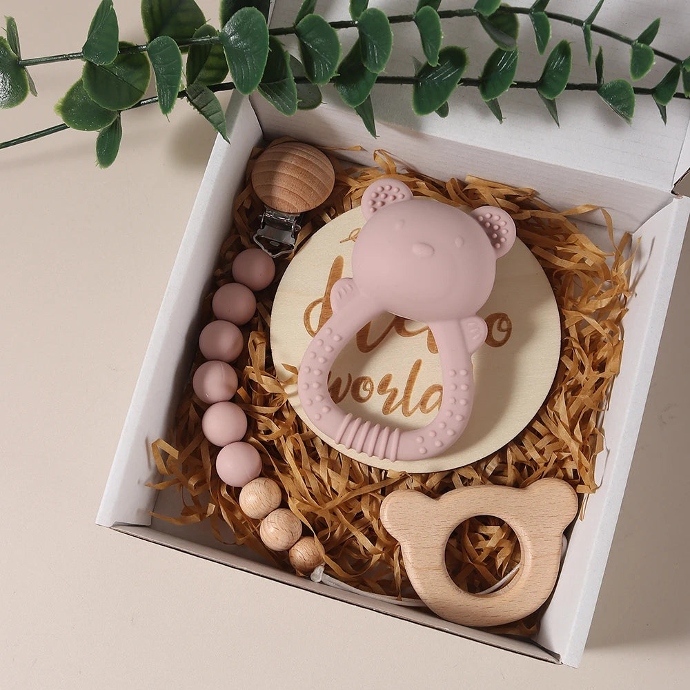 Cute bear rattle toy teether with beech wood bear in a white box.