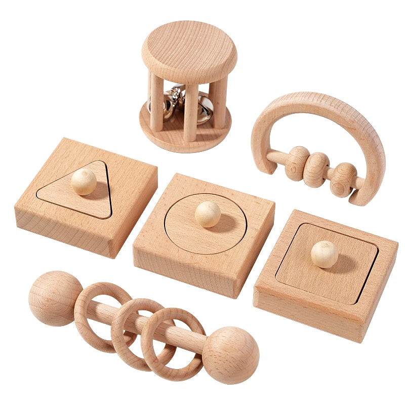 Set of wooden baby toys on a white background