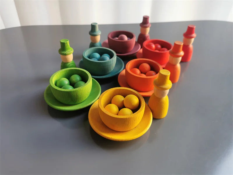 Colorful wooden toys on a gray surface