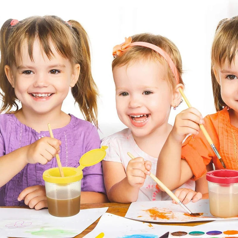 Three children engaged in a craft activity with colorful materials.