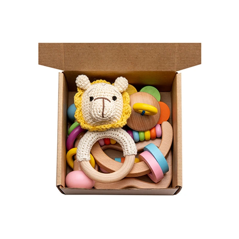 Wooden Baby Rattle Gift Set featuring Montessori-inspired, sensory-stimulating rattles in a box, ideal for infant development and engagement. Perfect eco-friendly gift for new parents.