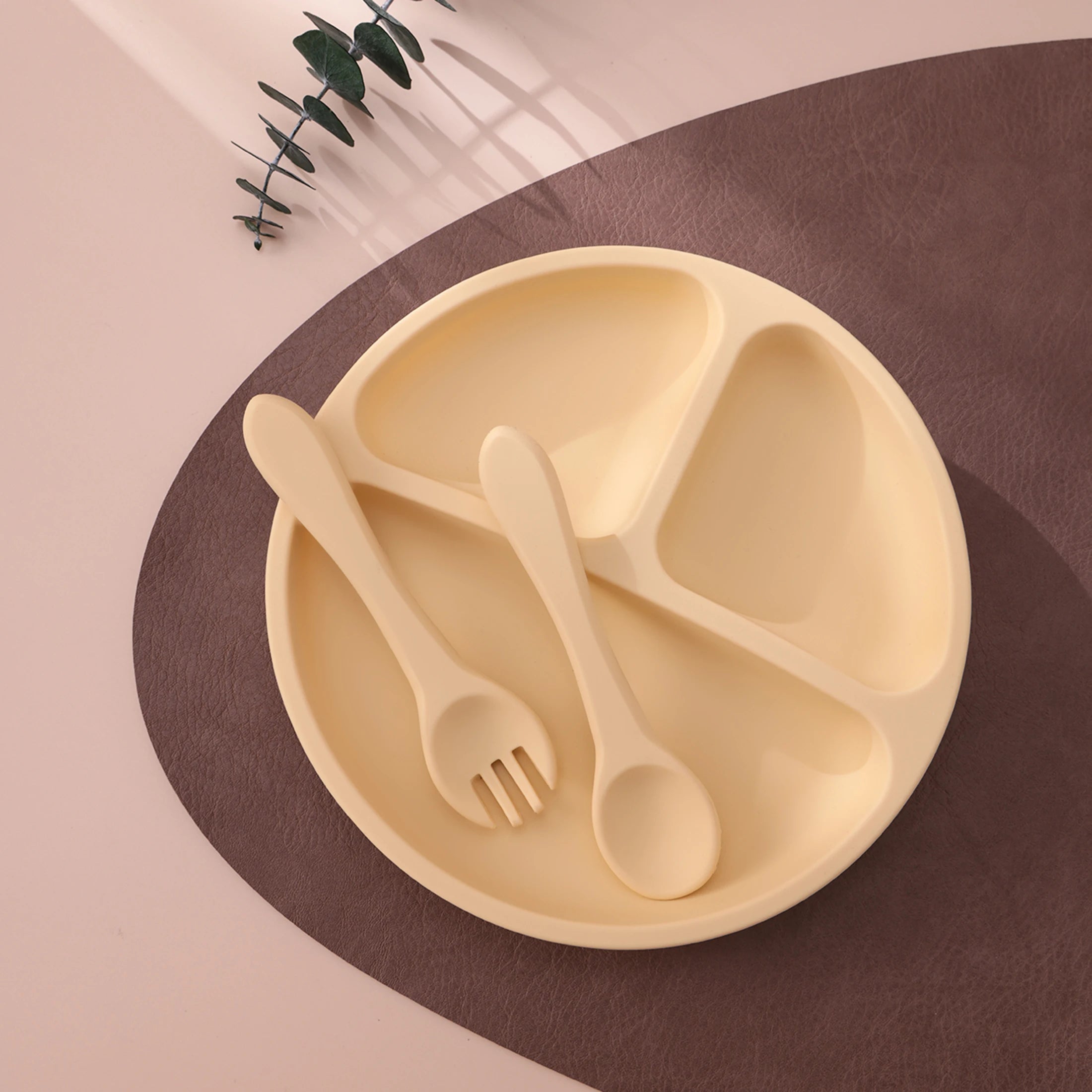 Light yellow plate with matching spoon and fork