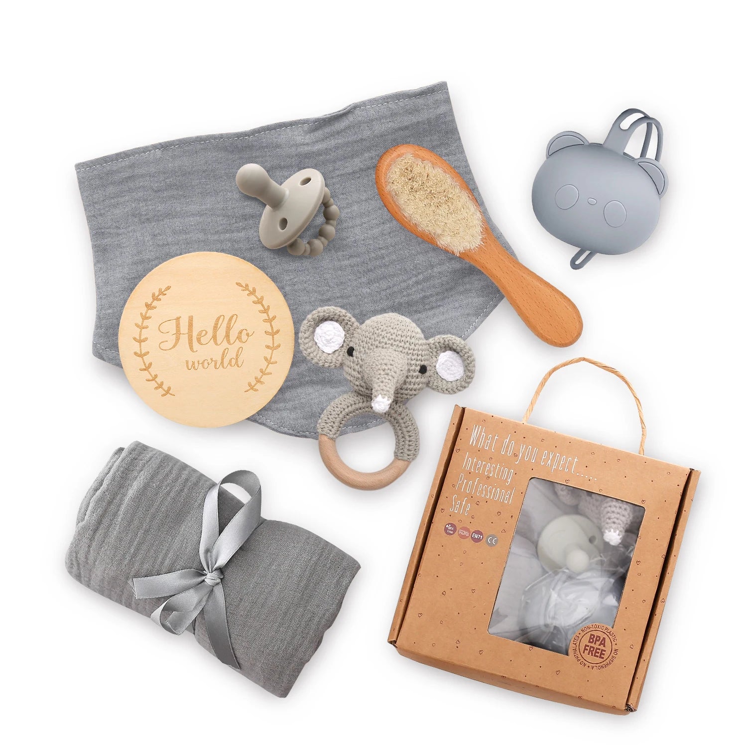 Collection of baby items including a pacifier, rattle, and swaddle on a white background