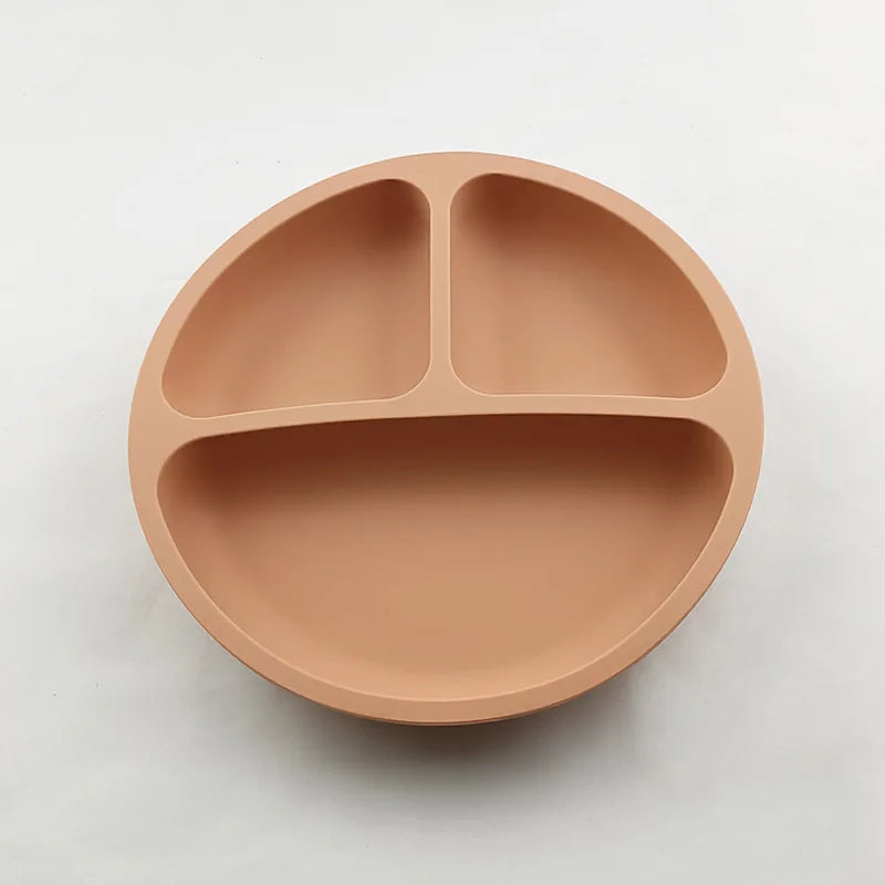 Beige divided plate on a light gray background