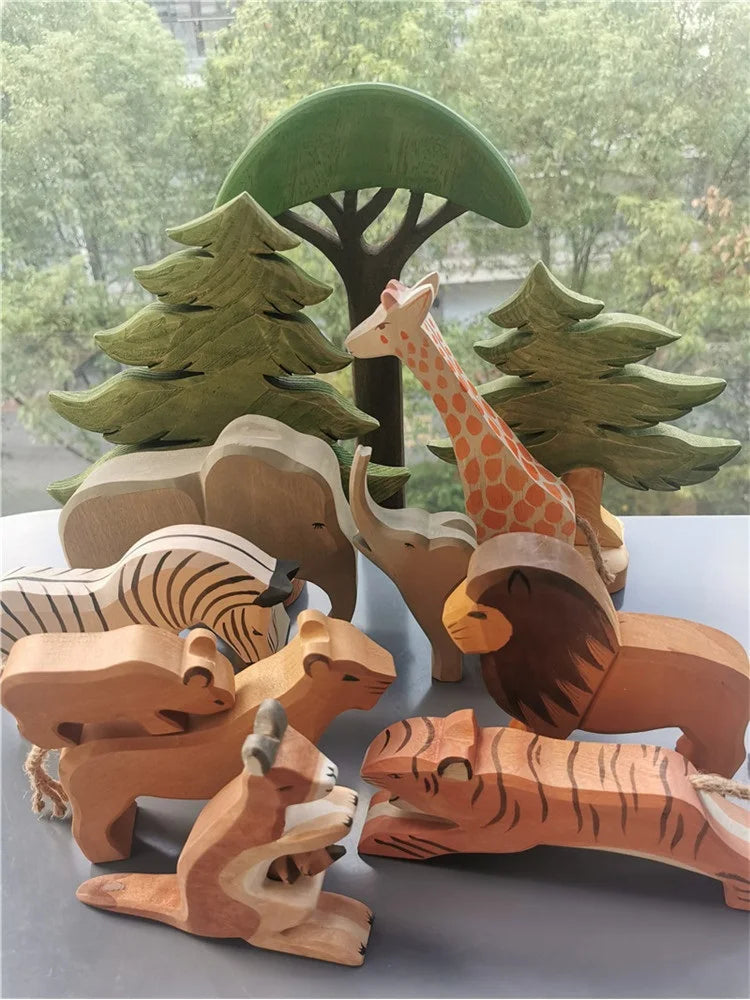 Wooden animal toys including a giraffe, elephant, zebra, and tiger in front of a forest background.