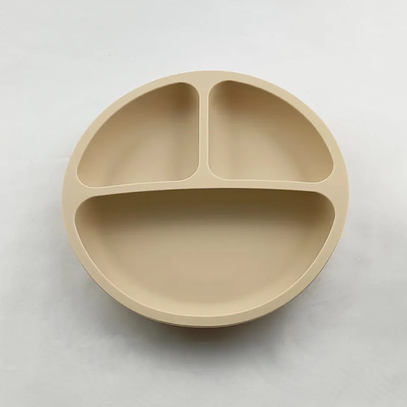 Beige divided plate on a light gray background
