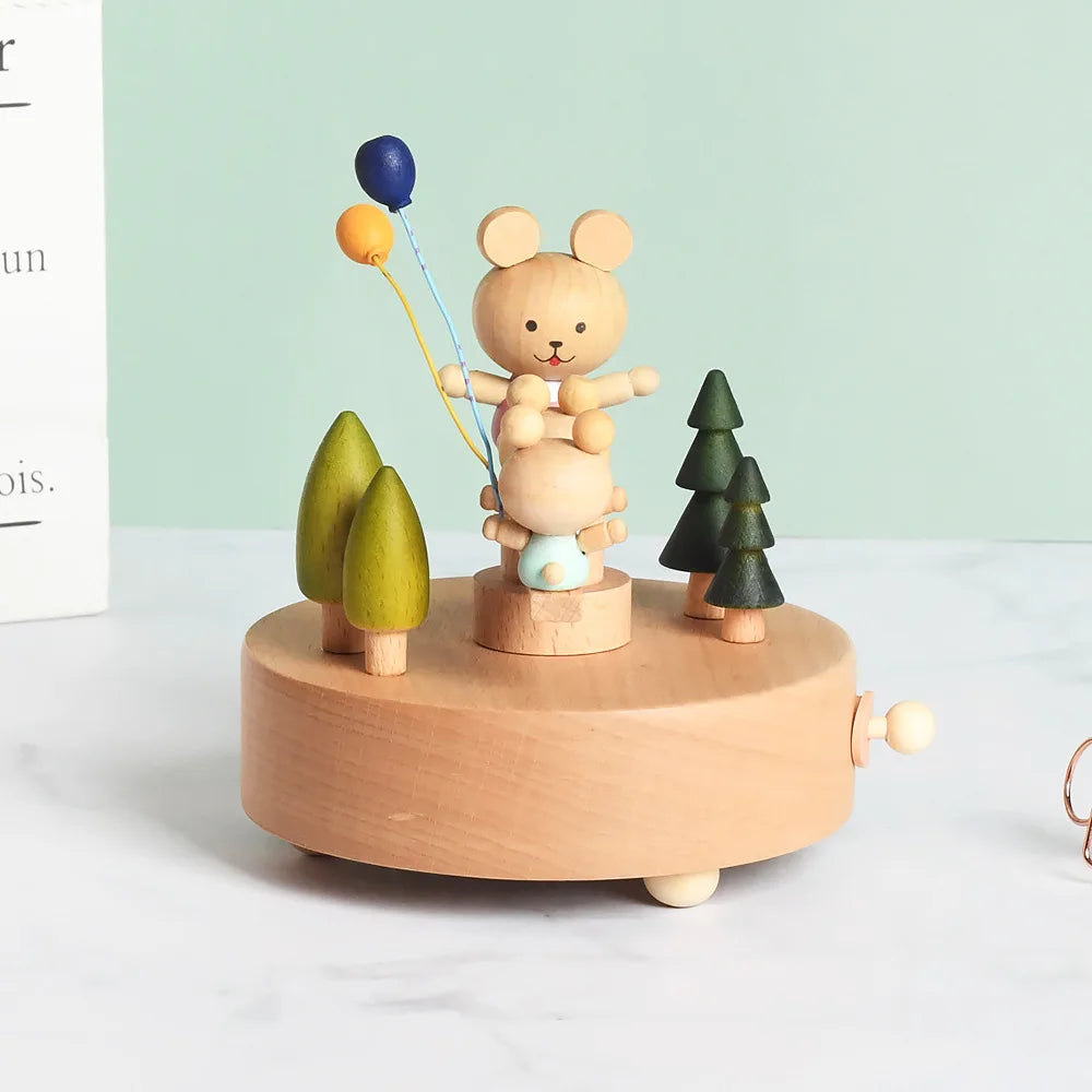 Wooden toy with a bear holding balloons and trees on a white surface with a light green background