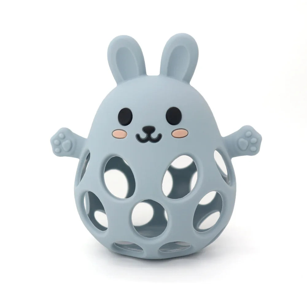 Blue rabbit-shaped toy with holes on a white background