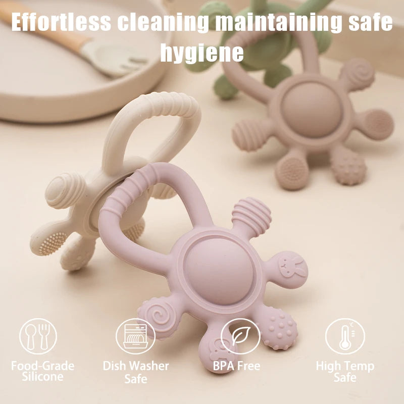 Pink silicone teether with text highlighting safety features on a beige background