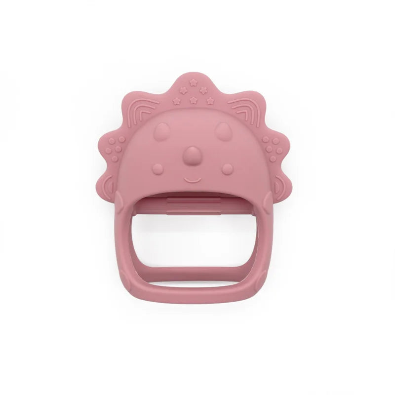 Pink dinosaur-shaped teething ring on a white background