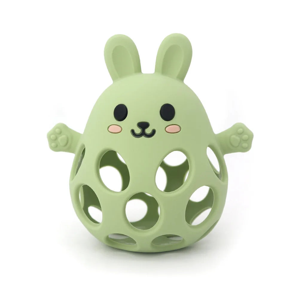 Green rabbit-shaped toy with a face on a white background