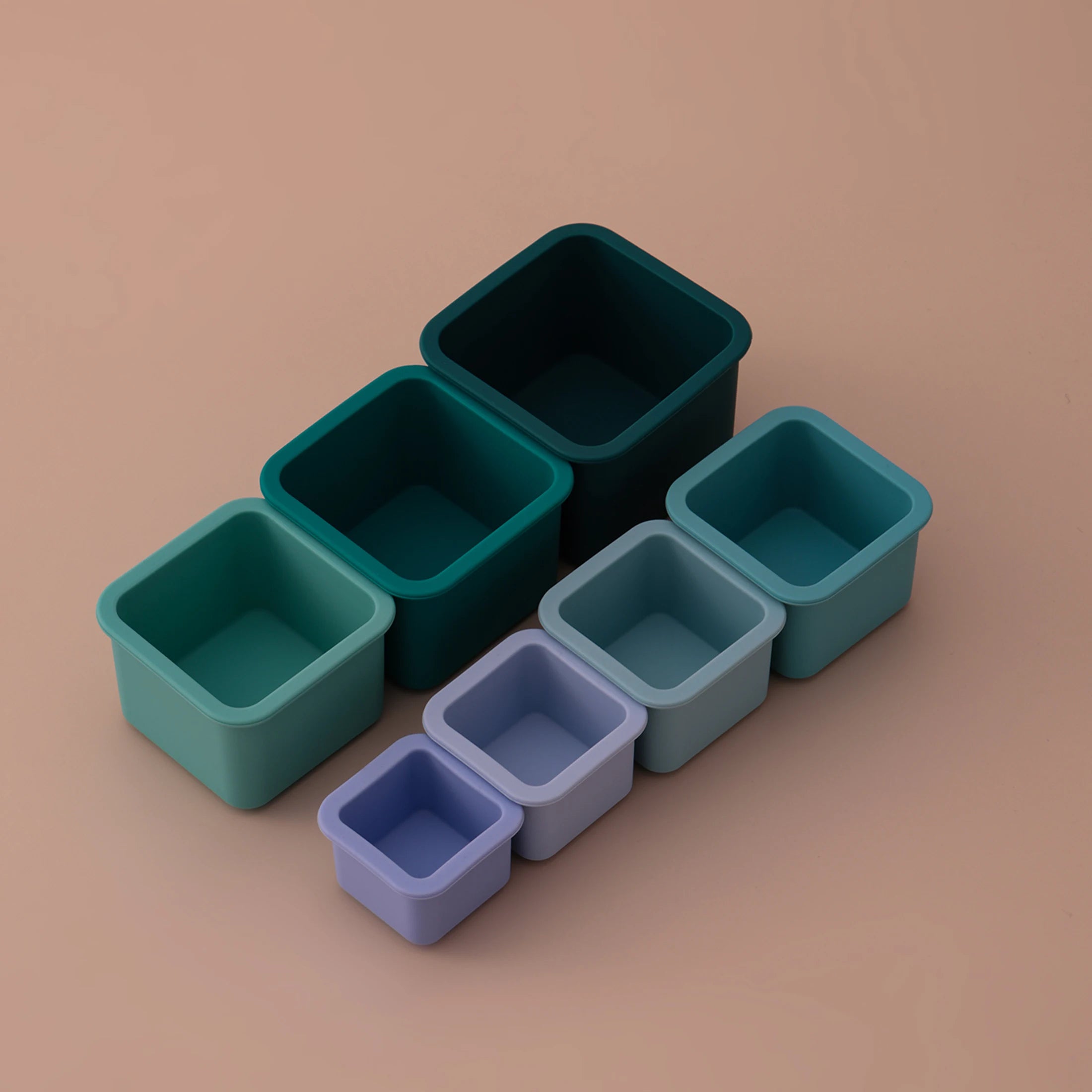 Square silicone nesting cups laid out by size
