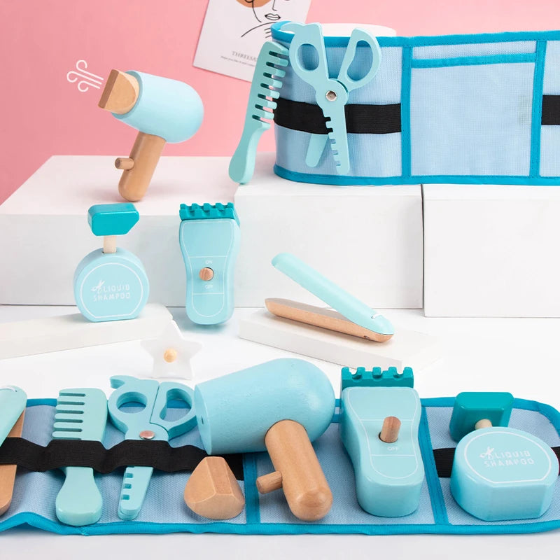 Set of toy grooming tools with a blue carrying case on a pink and white background