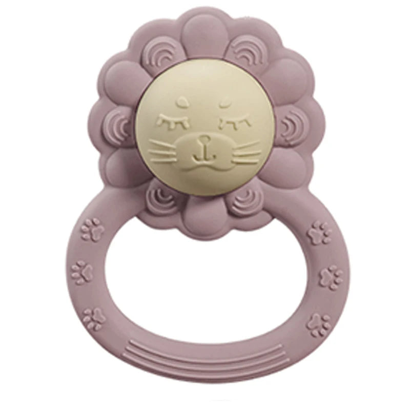Pink lion-shaped teething ring on a white background
