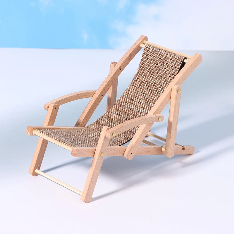 Wooden deck chair with woven seat and backrest on a light blue background