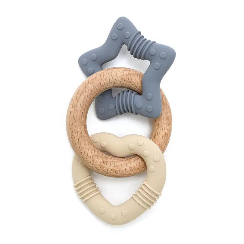 Teething ring with wooden and silicone components on a white background