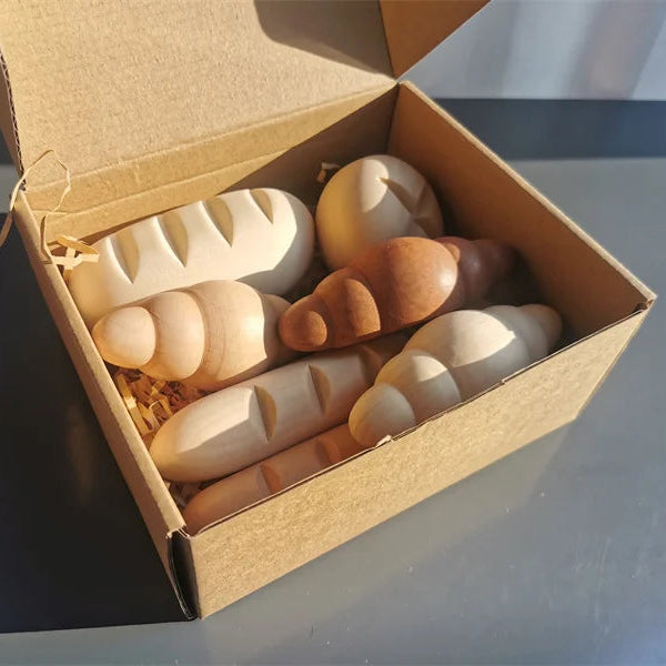 Box of wooden toys on a reflective surface