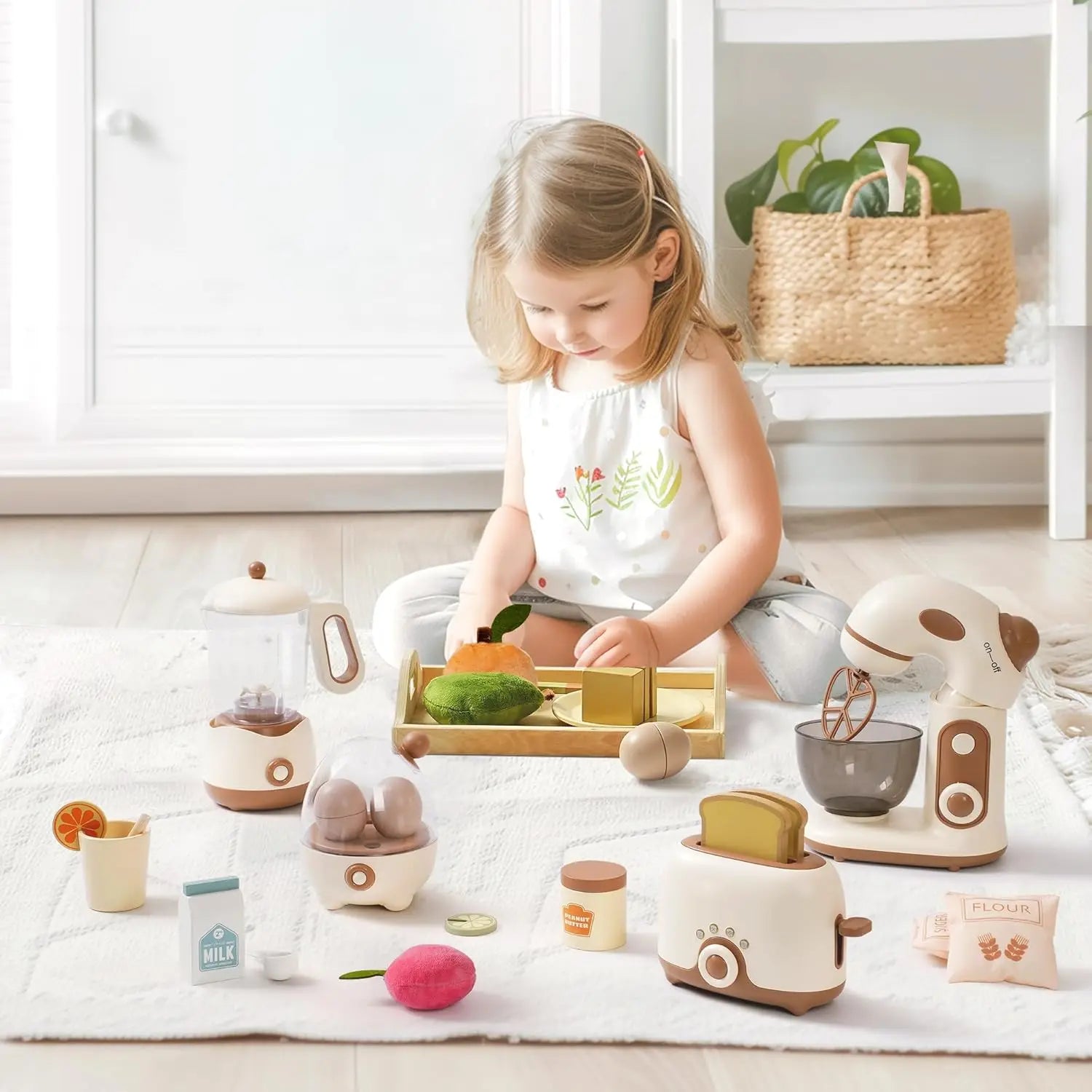 Child playing with a toy kitchen set on a light-colored floor.
