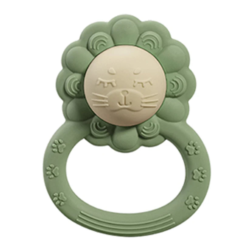 Green lion-shaped teething ring on a white background