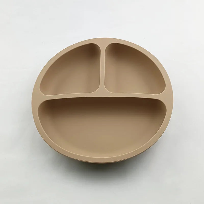 Beige divided plate on a light gray background