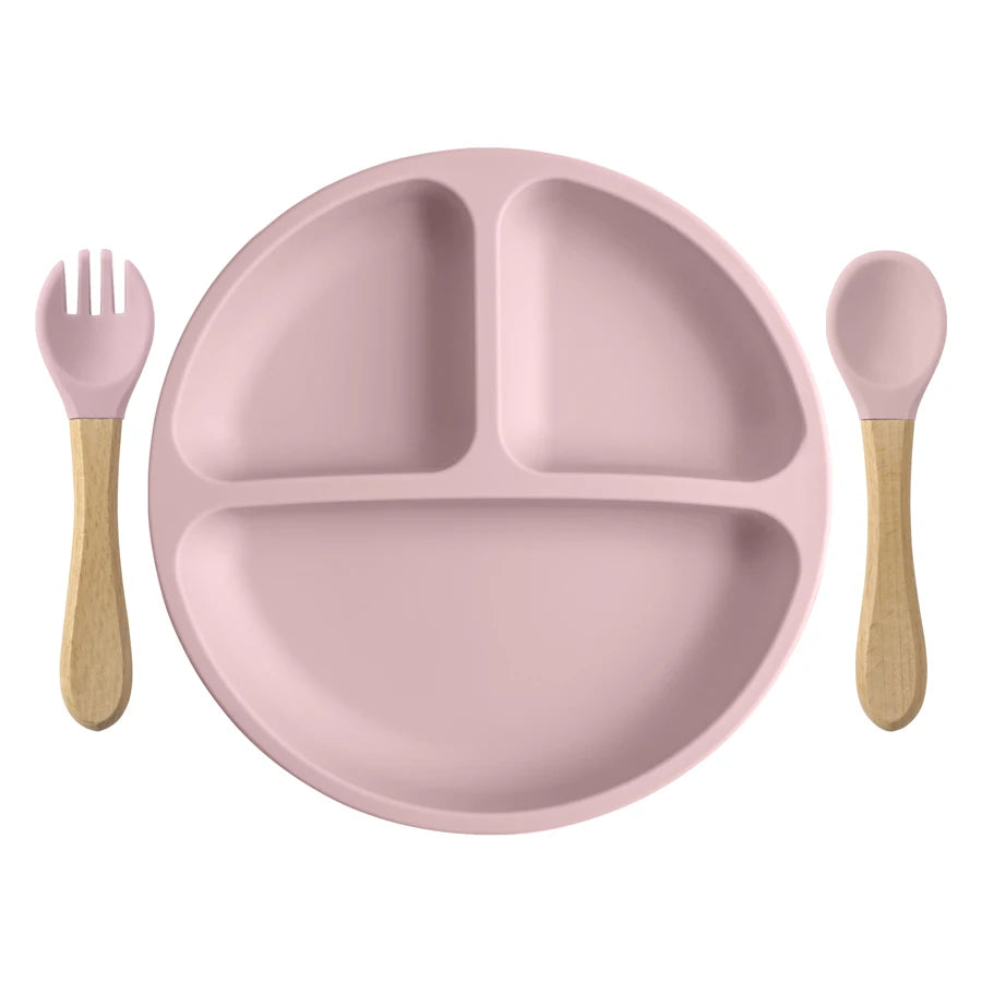 Light Pink round divided plate with wooden spoon and fork