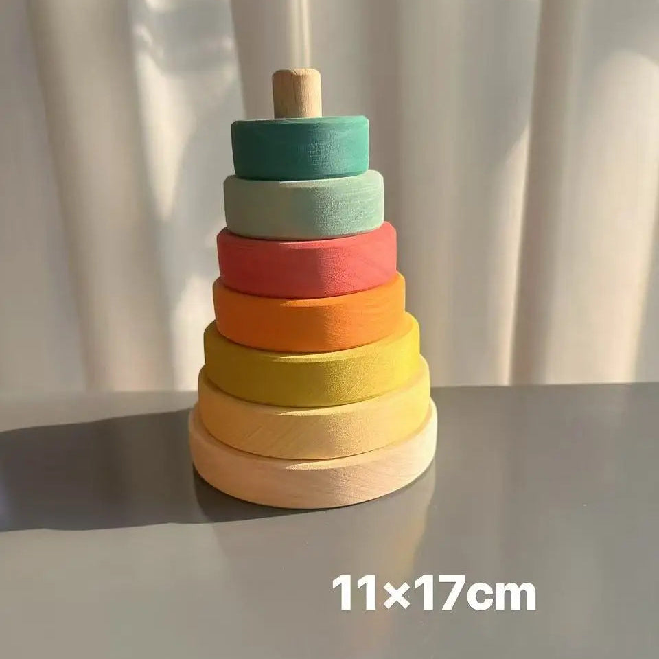 Colorful wooden stacking toy on a white surface with a light background
