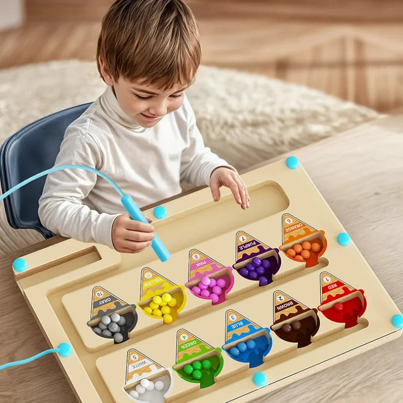 Child playing with a colorful educational toy on a wooden surface