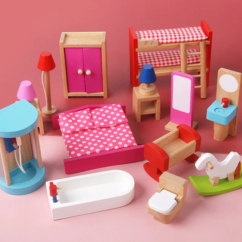 Set of colorful toy furniture on a pink background