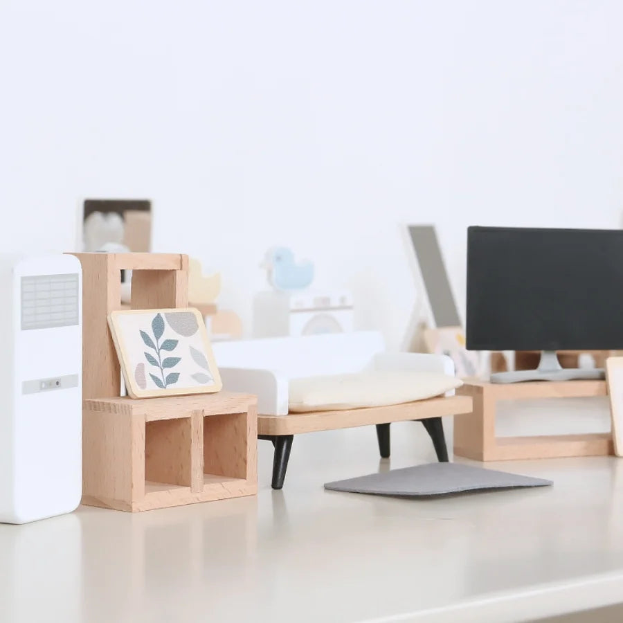 Modern office setup with wooden desk and chair, white walls, and minimal decor.