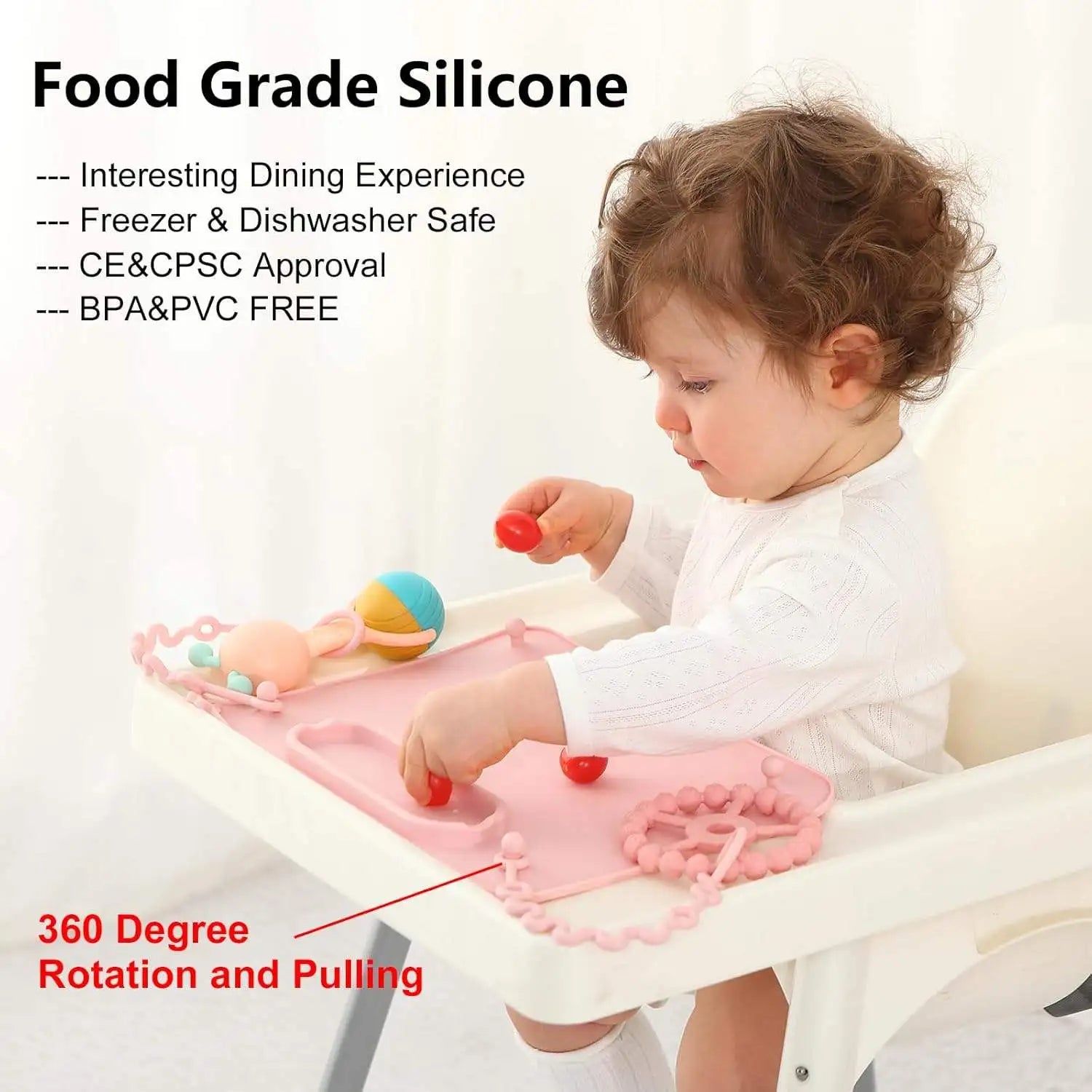 Pink suction mat on a high chair tray with toys on straps