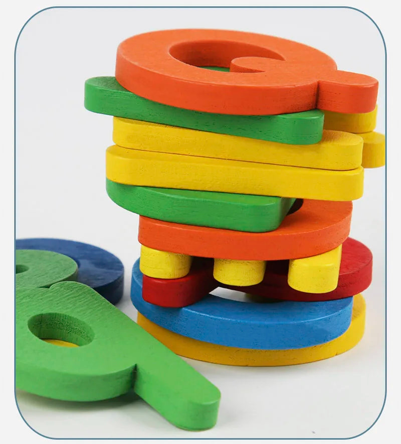 Colorful wooden letter blocks stacked on a white background