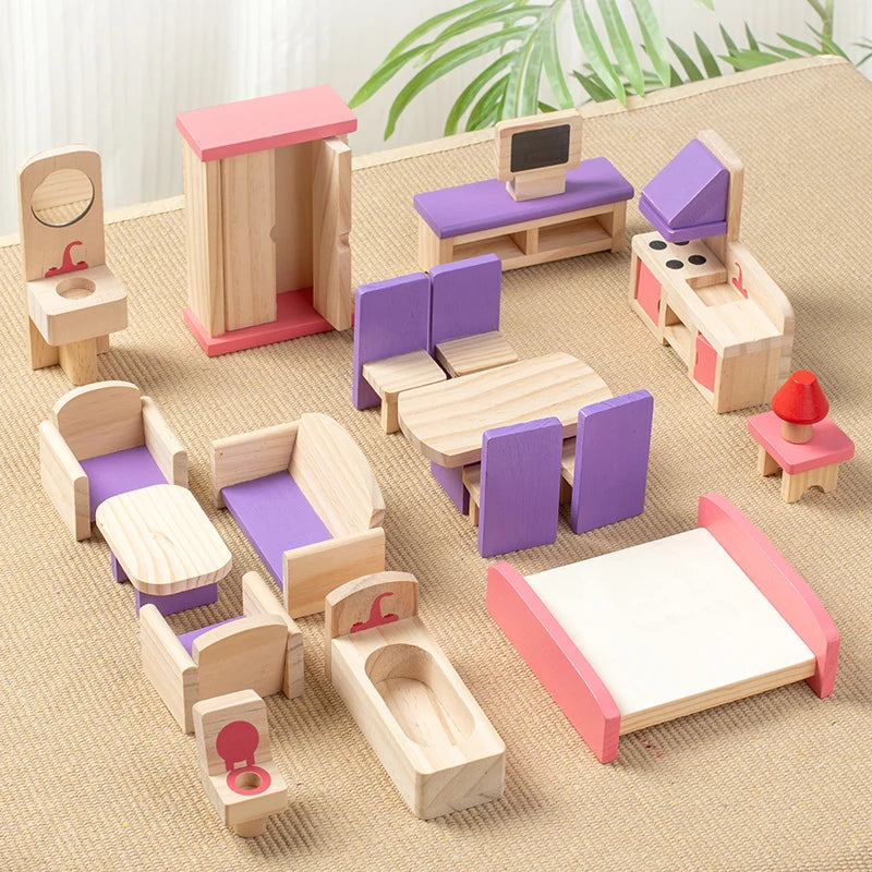 Set of wooden toy furniture including a kitchen, living room, and bathroom on a textured surface.