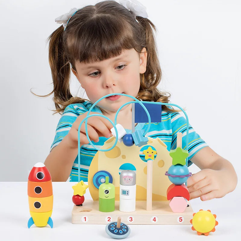 Child playing with a colorful educational toy on a white background