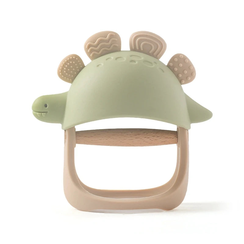 Green and beige turtle-shaped teether on a white background