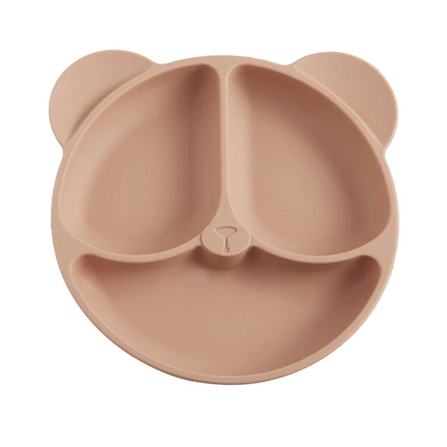 Pink bear-shaped divided plate on a white background