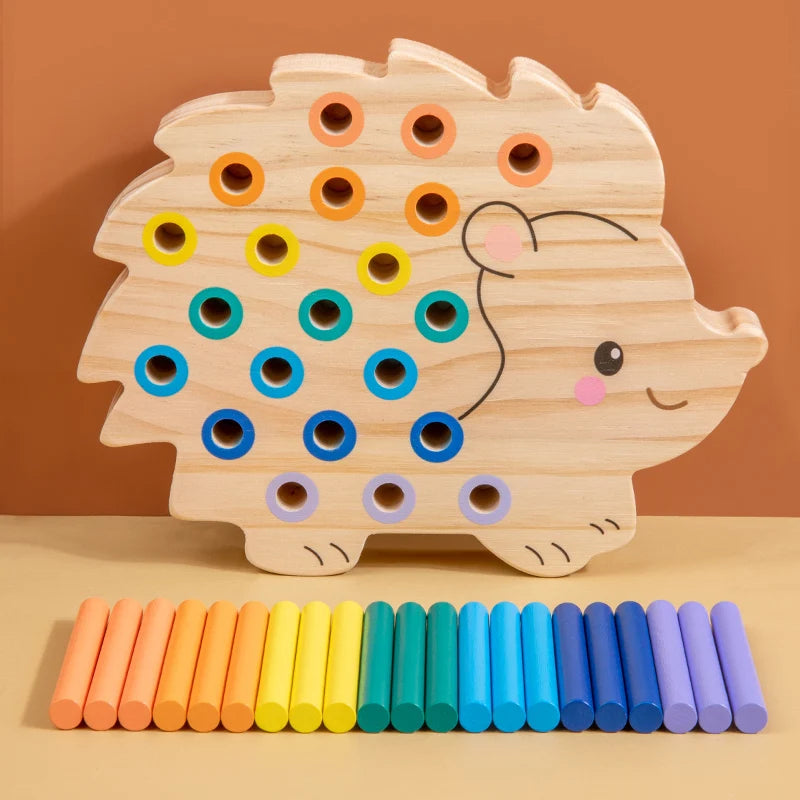 Wooden hedgehog toy with colorful pegs on a brown background